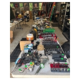 A folding table for sale, loaded with a variety of tools and bits and anything you could need.