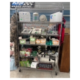 An available shelving unit with glasses and other decorative items.
