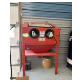 A housing unit for a sand blaster.