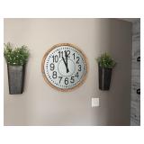 rustic farmhouse-style wall clock features a circular galvanized metal face with large black numeric