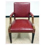 1206	RED LEATHER ARM CHAIR WITH BRASS TACK ACCENTS, APPROXIMATELY 25 IN X 22 IN X 35 IN H