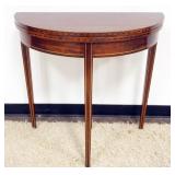 1207	MAHOGANY DEMILUNE FLIP TOP TABLE WITH PENCIL INLAY AND BANDED BORDER, APPROXIMATELY 32 IN X 16 