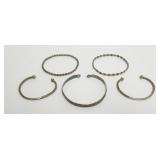 1135	GROUP OF ASSORTED BANGLE BRACELETS, SOME MARKED STERLING