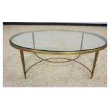 1189	ITALIAN OVAL BRASS GLASS TOP COCKTAIL/COFFEE TABLE, APPROXIMATELY 48 IN X 31 IN X 17 IN HIGH
