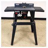 1207	CRAFTSMAN 1 1/2 H.P. ROUTER MOUNTED TO SHAPER BASE, APPROXIMATELY 34 IN X 14 IN X 40 IN