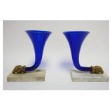 1104	PAIR OF COBALT GLASS CORNICOPIAS W/GILT METAL RAMS HEAD MOUNTED ON MARBLE BASES, EACH APPROXIMATELY 6 IN X 3 IN X 8 IN HIGH