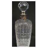 1120	CUT CRYSTAL DECANTOR W/SILVERPLATE COLAR MADE IN PORTUGAL, APPROXIMATELY 10 3/4 IN HIGH
