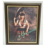 1034	LINDA RONSTADT FRAMED PHOTO, SIGNED SIGNATURE ON PHOTO, APPROXIMATELY 10 IN X 12 IN OVERALL