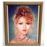 1036	BERNADETTE PETERS FRAMED PHOTO, SIGNED SIGNATURE ON PHOTO, APPROXIMATELY 9 IN X 11 IN OVERALL