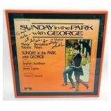1116	STEPHEN SONDHEIM FRAMED & MATTED ALBUM *SUNDAY IN THE PARK WITH GEORGE*, APPROXIMATELY 15 IN X 