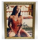 1120	JENNIFER LOPEZ FRAMED PHOTO W/ATTRIBUTED SIGNATURE, APPROXIMATELY 9 IN X 11 IN OVERALL