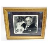 1121	FRANK SINATRA FRAMED PHOTO W/DOG & ATTRIBUTED SIGNATURE, APPROXIMATELY 14 IN X 17 IN OVERALL
