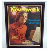 1124	STEPHEN SONDHEIM FRAMED NEWSWEEK COVER W/ATTRIBUTED SIGNATURE, APPROXIMATELY 10 IN X 13 IN OVER