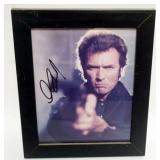 1163	CLINT EASTWOOD FRAMED PHOTO W/ATTRIBUTED SIGNATURE, APPROXIMATELY 10 IN X 12 IN OVERALL