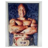 1182	GEORGE FOREMAN FRAMED PHOTO W/ATTRIBUTED SIGNATURE