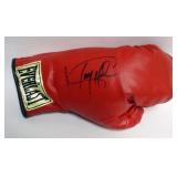 1191	EVERLAST BOXING GLOVE WITH SIGNATURE ATTRIBUTED TO LARRY HOLMES