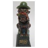 1086	BOOK OF KNOWLEDGE *OLE PUFFER* MECHANICAL BANK, APPROXIMATELY 9 IN H
