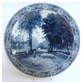 1013	LARGE DELFT CHARGER W/IMAGE OF WOMAN HERDING SHEEP DOWN WOODED LANE, APPROXIMATELY 15 1/2 IN