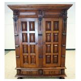 1234	CONTINENTIAL 2 DOOR OVER 2 DRAWER CUPBOARD WITH PANELED DOORS AND SIDES. REEDED COLUMNS, CARVED