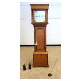 1143	WALKER INNEMOTE GRANDFATHER CLOCK IN OAK CASE WITH REEDED QUARTER COLUMNS AND HAND PAINTED DIAL