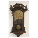 1224	VICTORIAN WALL CLOCK IN CARVED WALNUT CASE, APPROXIMATELY 13 IN X 5 IN X 29 IN
