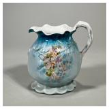 Ceramic Pitcher With Floral Design | With impressed number on bottom. Dimensions: h. 6.5 x w. 7 in