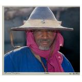 Jim Spillane (American, 1950s-) Photograph - "Mali" | Portrait of a smiling Mali man with a gray bea