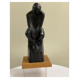 Mohamed Hussein Hagras (Egyptian, 1924-2004) Sculpture - "Man Seated" | Black marble or other materi