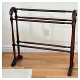 Blanket/Quilt Stand | Of dark wood with spindle racks and legs. Dimensions: h. 35 x w. 35.5 x d. 7 i