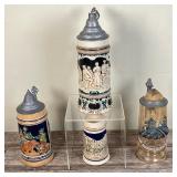 (4pc) VINTAGE BEER STEINS | Lot of four German Steins including: 1. Tall .5L Green & Cream Stein w/d