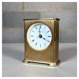 Tiffany & Co. Small Brass Desk Clock | With Roman numeral markers; quartz movement Dimensions: h. 3.