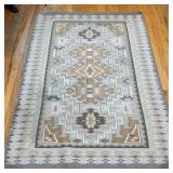 Southwest Flat Woven Rug | Featuring a soft, muted palette of taupe, sage, cream, and gray arranged 