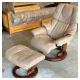EKORNES STRESSLESS LOUNGER & OTTOMAN | Light colored leather chair with circular wood footing and ma