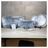 (4pc) Nambe Serving Platters And Pewter Dish | Three oblong platters, one with handles. In addition,
