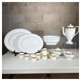 (23pc) Wedgewood “Ascot” Bone China Demitasse Set | Gold trim borders on cream colored china. Includ