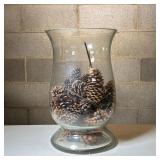Extra Large Glass Votive | Heavy glass hurricane-shaped vase filled with pinecones Dimensions: h. 16