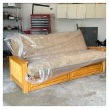 FOLDING FUTON SOFA IN EXCELLENT CONDITION | Having a faux suede single mattress/cushion on a wooden 