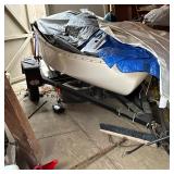 SMALL 9.5ft SAILBOAT AND TRAILER | Wood interior with blue paint on a fiberglass hull