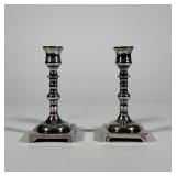 PAIR OF ENGLISH SILVER-PLATED BALUSTER FORM CANDLESTICKS | This pair of silver-plated candlesticks f