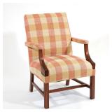 GEORGE III STYLE MAHOGANY LOLLING CHAIR | High-back armchair upholstered in a tan and salmon-colored