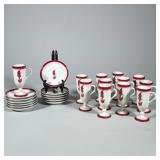 STERLING CHINA VITRIFIED FOOTED CUPS & SAUCERS WITH RED CAVALIER MOTIF | A set of twelve footed chin