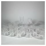 (20pc) WATERFORD STYLE CUT CRYSTAL BARWARE SET | Set of twenty clear cut crystal glasses featuring a
