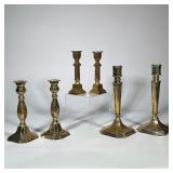 (6pc) GRADUATED BRASS CANDLESTICKS | Lot includes three pairs of brass candlesticks in varying gradu