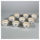 (9pc) SET OF GILT DECORATED PORCELAIN TEACUPS | Set of nine white porcelain footed teacups featuring