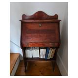 antique wooden drop-front secretary desk, books