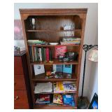 Wooden bookshelf, books, Photo paper, trophy, floor lamp