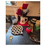 heavy duty pizza cutter, Green glass stemware, Severing Untesils, kitchen timer, grater, wooden spoo