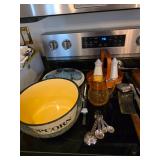 Measuring spoons, popcorn bowl, yellow glass pitcher