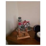 Light house, trinket men playing chess