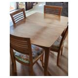 Table and four chairs, leaf not pictured